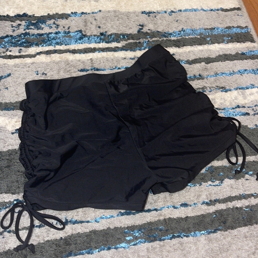 swimsuit material shorts. short swimsuit bottoms. adjustable legs. black size M